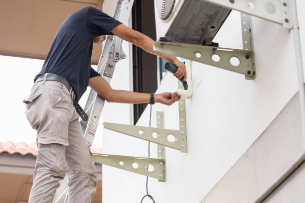 istock Technician man using a screwdriver to fix and install new air conditioner, repairing and servicing, Maintenance, and repairing concepts 2103242890