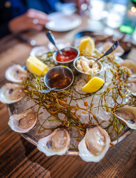 istock A dozen of raw oysters on an ice platter 2103246652