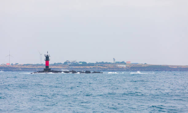 istock Island scenery seen from the sea on a cloudy day. 2103264354