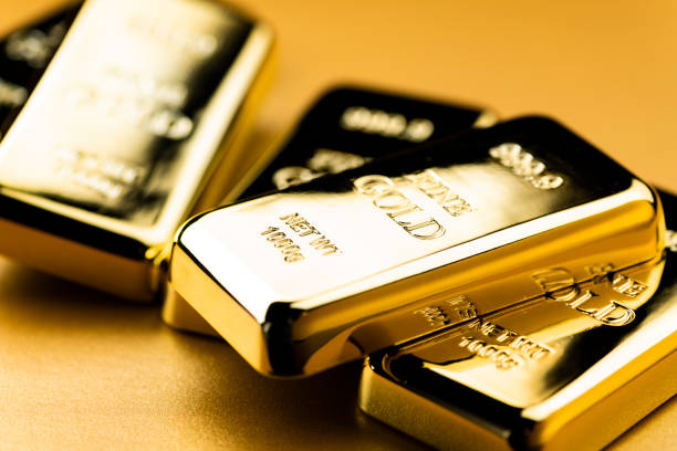 istock Image of Gold Ingots on Golden Background 2103269005