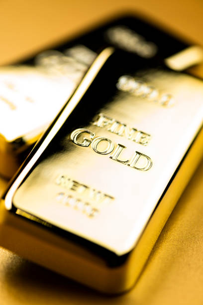 istock Image of Gold Ingots on Golden Background 2103269011