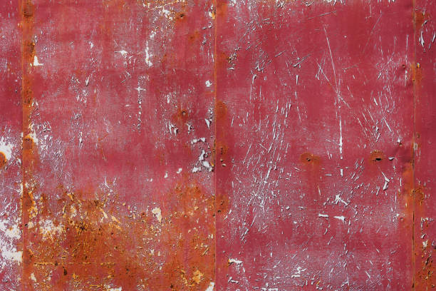 rusty red painted flat sheet metal surface full-frame background and texture - spotted paint red wall fotografías e imágenes de stock