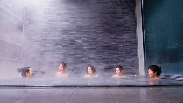 Steamy fog rises from a heated indoor swimming pool on a cold chilly morning, Indiana, Midwest, USA