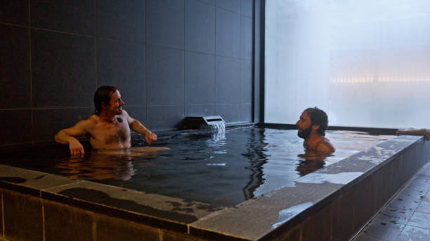 Two caucasian sitting in an indoor onsen at a ski resort in Niseko, Japan