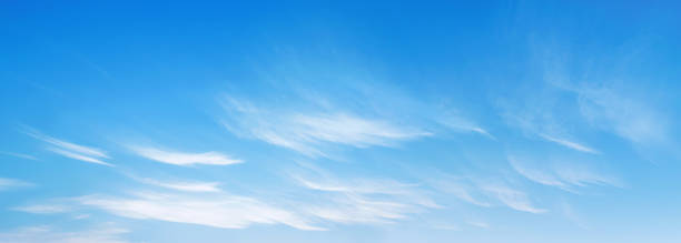 istock sky is blue and clear with a few clouds scattered throughout 2103323537