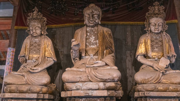 istock Buddha statues on the Way to Dazu Rock Carvings 2103352485