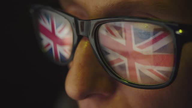 Cg footage. The glasses on the female face reflect the search for information on the Internet and the UK flag