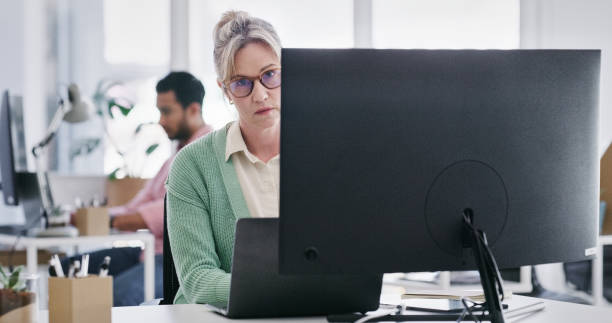 istock Bored, tired and a business woman using a computer at work while feeling annoyed or frustrated. Depression, burnout and thinking with employee suffering in a modern office and pc with mistake or fail 2103403930