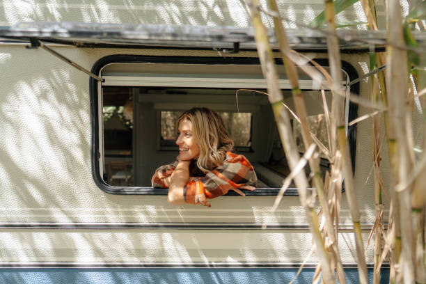 istock Woman in her camper van 2103406632