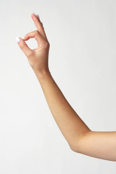 istock Female hand showing OK sign on white background 2103411322