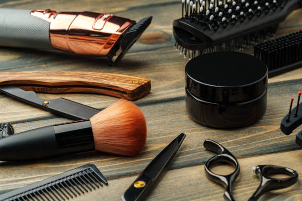 istock Set of professional barber tools on wooden table 2103420326
