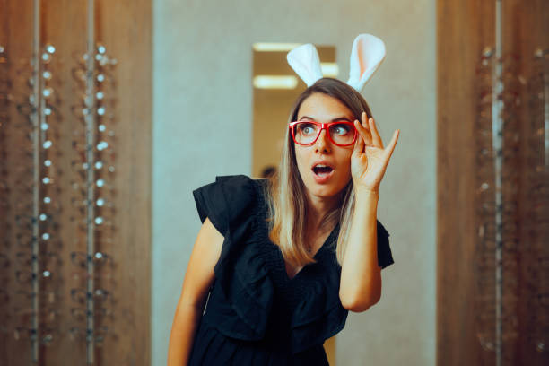 istock Woman Wearing Red Eyeglasses and Easter Bunny Ears 2103421429