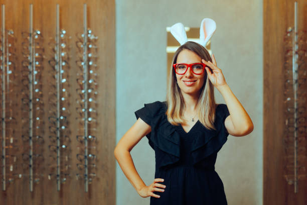 istock Woman Wearing Red Eyeglasses and Easter Bunny Ears 2103421432