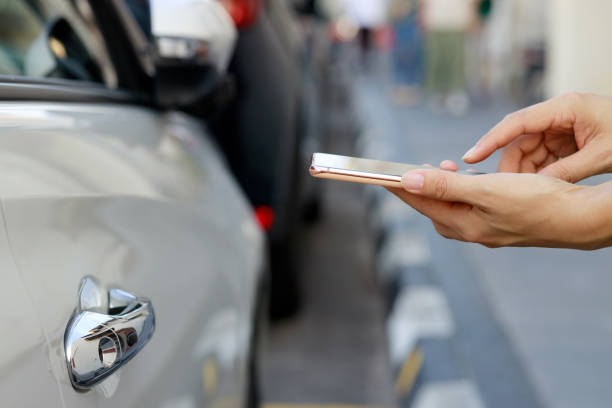 istock In the close-up shot, a female is seen using her smartphone while waiting for pickup on a downtown city street. 2103432946
