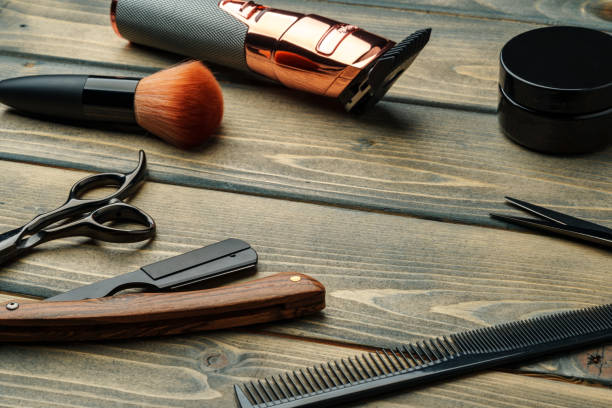 istock Hairdressing barber tools on wooden background close up 2103438722