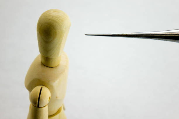 A person with apical phobia who is scared of a pointed object