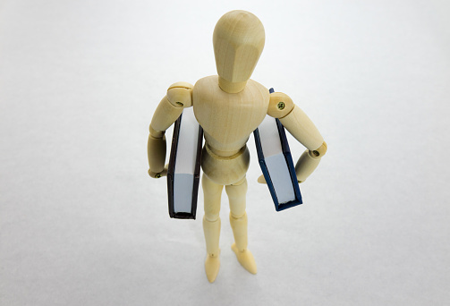 Person holding a big book