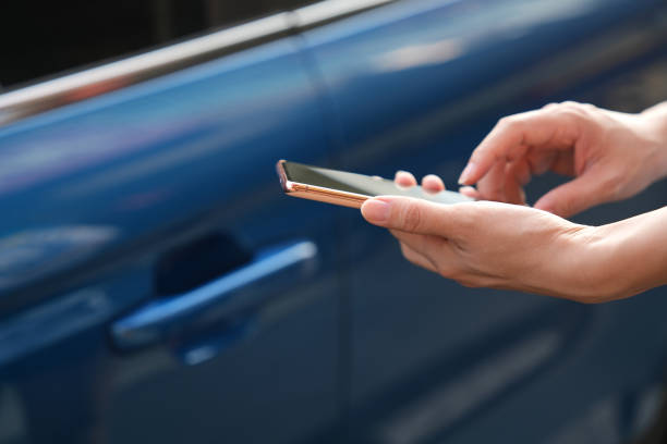 istock In the close-up shot, a female is seen using her smartphone while waiting for pickup on a downtown city street. 2103469868