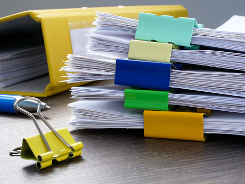 Close-up of a large stack of papers with a report. Accounting and business management.