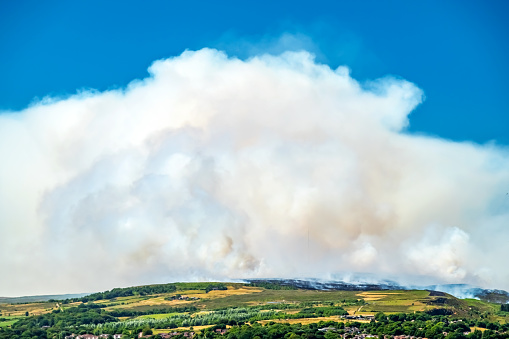 A huge out of control moorland wildfire on a Lancashire hillside, North West England, UK.