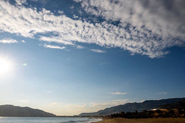 istock Beautiful sky above cumulus clouds with dramatic light and landscape 2103533642