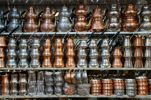 Copper coffee pots, teapots and pots in a traditional Turkish bazaar.