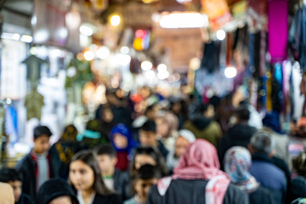 Blurred crowd of people in traditional Turkish bazaar.