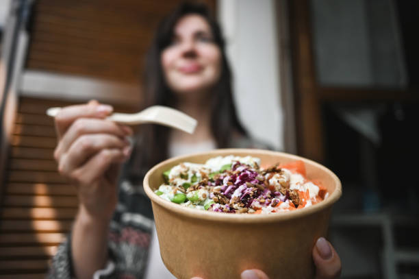 istock Woman eating seafood salad. 2103618194