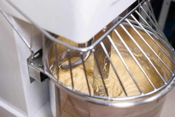istock A bread mixer in a bakery, kneading dough for baguettes and rolls. 2103684906