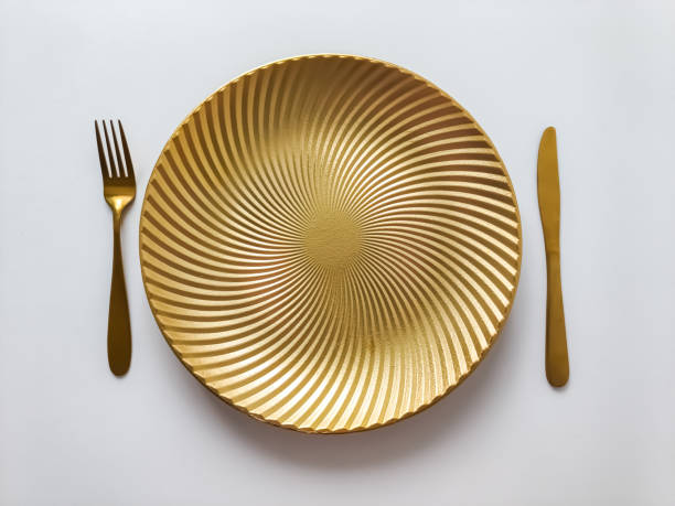 istock Gold cutlery and plate 2103699328