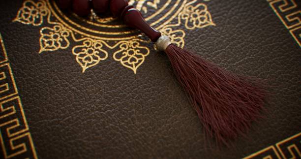 istock A religious book adorned with wooden rosary beads 2103706988