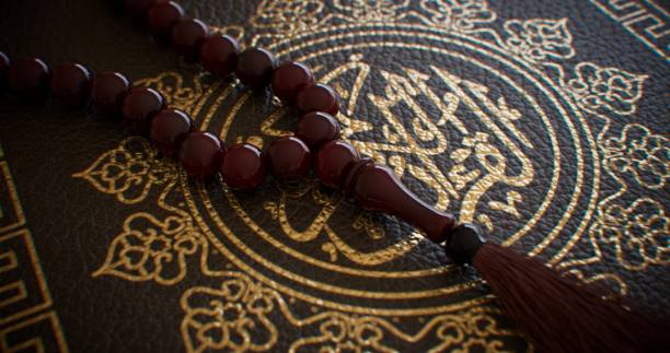 Delicately placed on the pages of a sacred book, wooden rosary beads contribute to the serene and reverent ambiance
