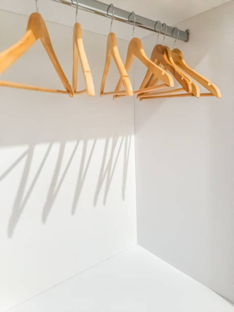 istock Wooden hangers on a clothes rail 2103708587