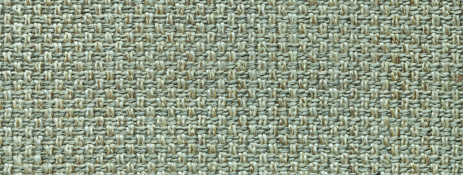 Texture of light green color background from woven textile material with wicker pattern, macro. Structure of vintage olive fabric cloth, narrow backdrop. Light olive background with checkered pattern, closeup. Structure of the green fabric macro.