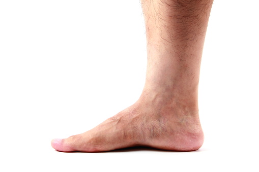 Man foot on white background
