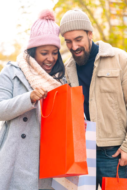 istock Vertical shot happy young couple outdoors looking shopping 2103756661
