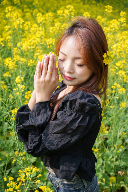 istock Female tourist among flowers 2103789392