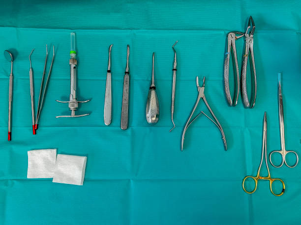 istock dental surgery tray, extraction session, on a sterile field with compresses. 2103789401