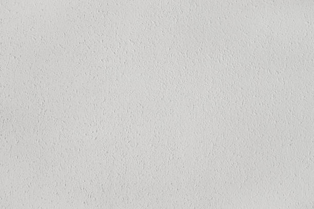istock White textured wall with reliefs. Background for designs 2103796646