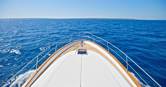 Empty yacht deck in Adriatic sea against clear sky during sunny day, Croatia.
