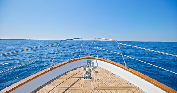 Empty bow of yacht in Adriatic sea against clear blue sky during sunny day, Croatia.