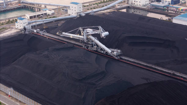 istock mining shovels, coal mine excavator working loading coal mine to Coal-fired power plant . Giant wheel of bucket wheel excavator in a brown coal open pit 2103812105