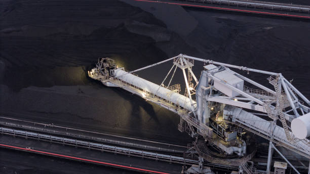 istock mining shovels, coal mine excavator working loading coal mine to Coal-fired power plant . Giant wheel of bucket wheel excavator in a brown coal open pit 2103812106