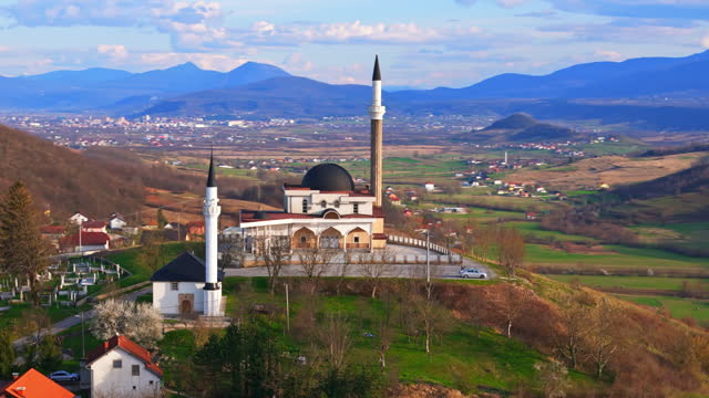 AERIAL Drone Shot of Mosque On Top Of Hill in Small Village Bihać, Bosnia And Herzegovina