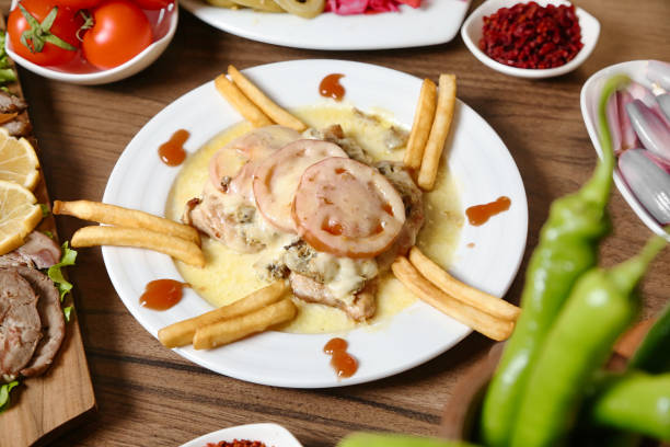 istock Wooden Table Adorned With Deliciously Plated Food 2103832230