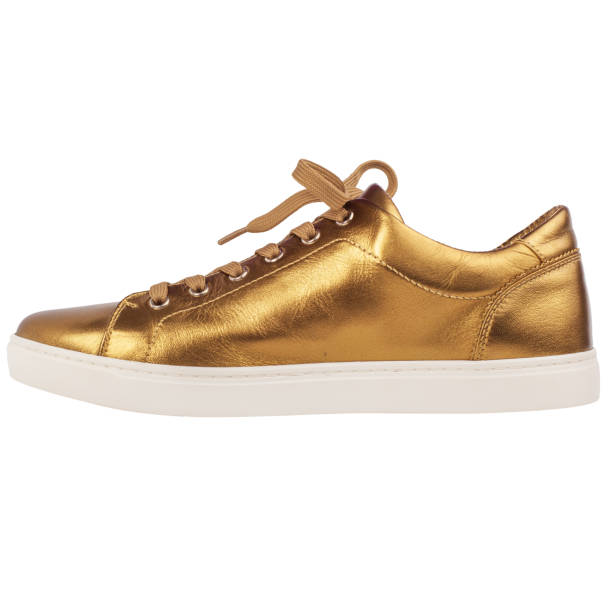istock Gold shoe on white background, isolated. 2103834292