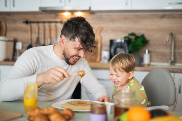 istock Having breakfast with my little boy. 2103862294