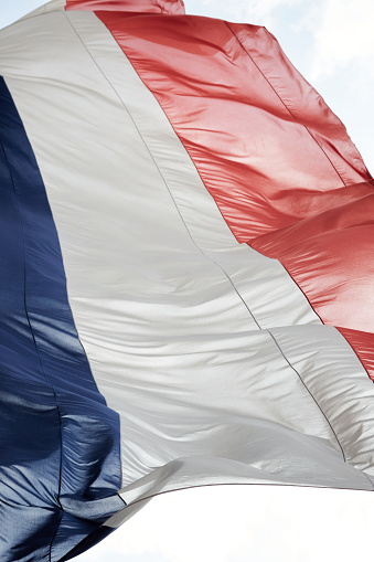 Close Up of French Flag Waving in Sunshine
