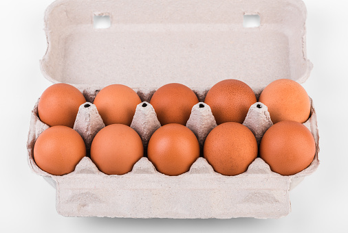 Egg, Chicken eggs in the package on a white background. Chicken eggs in a cardboard box.