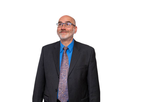 Happy mature business man facing camera and looking up while smiling on a white background